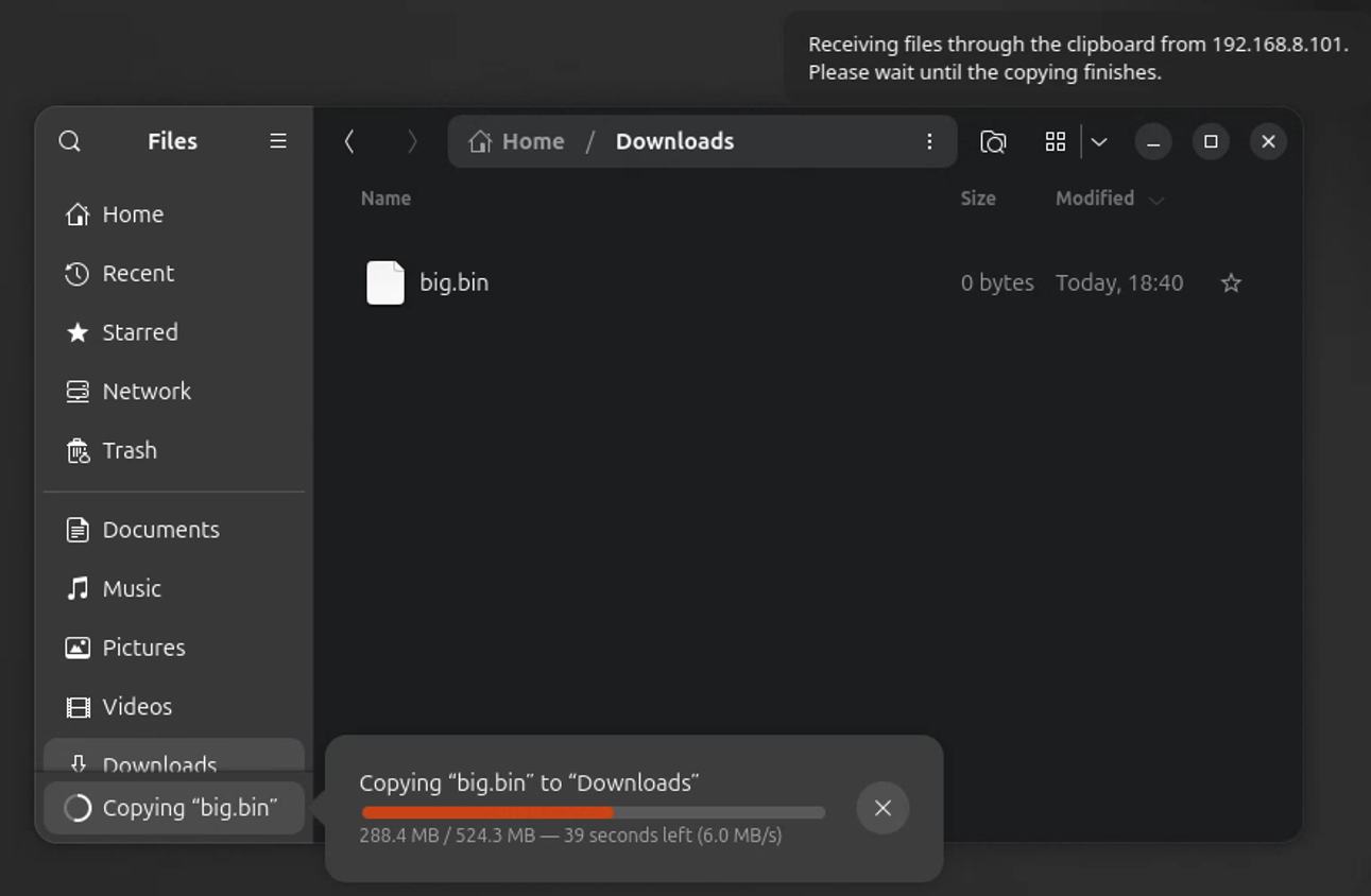 Ubuntu file manager copying a pasted file, with the Host notice 'Receiving files through the clipboard' in the corner of the screen